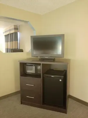 a flat screen tv sitting on top of a cabinet at Baymont Inn & Suites by Wyndham Huber Heights Dayton Northeast in Huber Heights