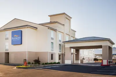 a hotel with a sign on the front of a building at Baymont by Wyndham Georgetown Lexington North in Georgetown