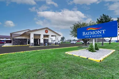 a sign in front of a building with a sign for bangmont fun and spices at Baymont by Wyndham Perrysburg-Toledo in Perrysburg