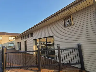 a building with a balcony and a window at Baymont by Wyndham Perrysburg-Toledo in Perrysburg