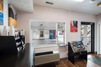 a store with a large window in a room at Motel 6-Parkersburg, WV in Parkersburg
