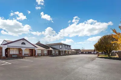 an empty parking lot in front of a building at Red Roof Inn Georgetown, KY in Georgetown