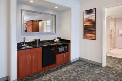 a bathroom with a sink and a mirror at Courtyard by Marriott Pittsburgh Washington Meadow Lands in Washington