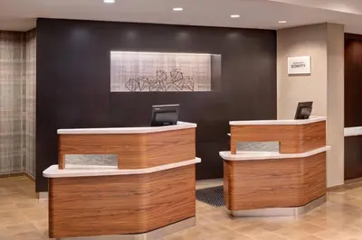 a lobby with two reception desks in a building at Courtyard by Marriott Pittsburgh Washington Meadow Lands in Washington