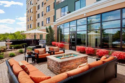 a patio with a fire pit in front of a building at Courtyard by Marriott Pittsburgh Washington Meadow Lands in Washington