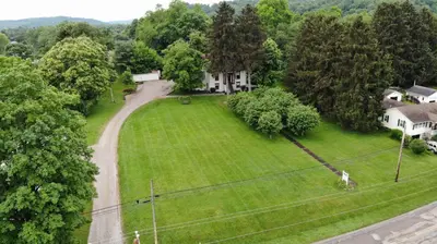 an aerial view of a yard with a house at The Pines of Dresden in Dresden