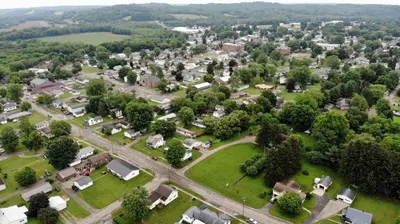 an aerial view of a small town with a park at The Pines of Dresden in Dresden