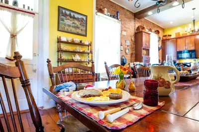 a table with a plate of breakfast food on it at The Pines of Dresden in Dresden