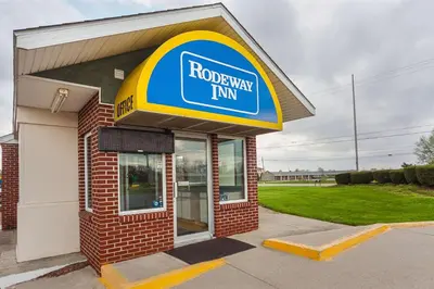 a rotary tum sign on the front of a building at Rodeway Inn Wauseon in Wauseon