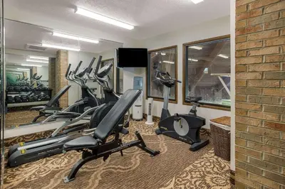 a fitness room with treadmills and exercise bikes at Quality Inn Ashland East in Ashland