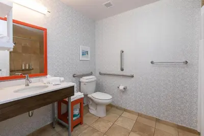 a bathroom with a toilet and a sink at Hampton Inn & Suites Wilder in Wilder