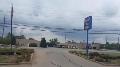 a gas station sign on the side of a road at Travel Inn in Sharonville