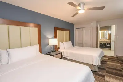 a bedroom with two beds and a ceiling fan at Homewood Suites Cincinnati Airport South-Florence in Florence