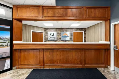 a wood paneled lobby with a waiting room at Quality Inn Mason Near Kings Island in Mason