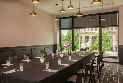 a conference room with a long table and chairs at Doubletree By Hilton Youngstown Downtown in Youngstown