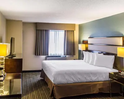 a hotel room with a large bed and a window at Quality Inn Streetsboro - Kent in Streetsboro