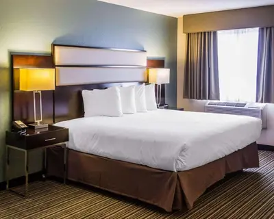 a hotel room with a large bed and a window at Quality Inn Streetsboro - Kent in Streetsboro