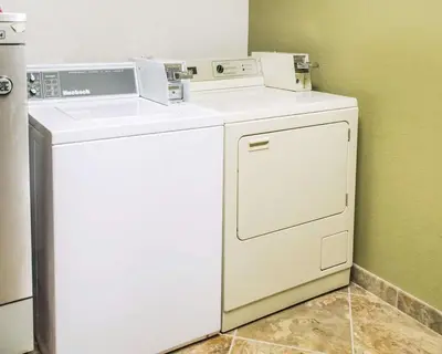 a white washer and dryer in a room at Quality Inn Streetsboro - Kent in Streetsboro