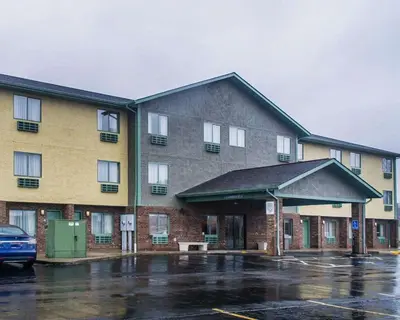 a building with a parking lot in front of it at Quality Inn Streetsboro - Kent in Streetsboro