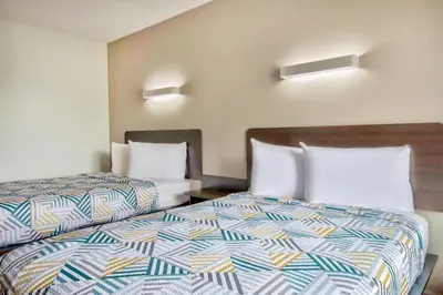 a hotel room with two beds in a room at Motel 6-Springfield, OH in Springfield