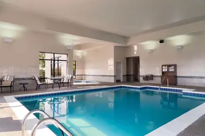 a swimming pool with blue water in a hotel at Hampton Inn Ft Wayne in Fort Wayne