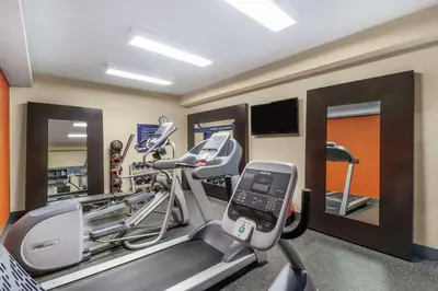 a gym with two tread machines and a treadmill at Hampton Inn Heath in Heath