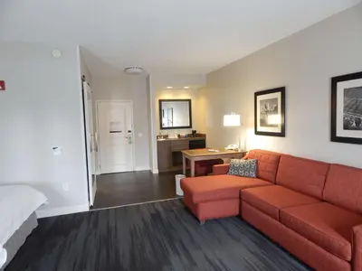 a living room with a couch and a table at Hampton Inn Heath in Heath
