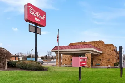 a red k rite aid sign in front of a building at Red Roof Inn Fort Wayne in Fort Wayne