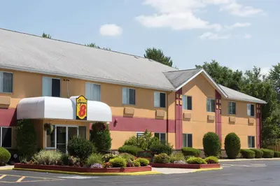 a hotel building with a fast food restaurant at Super 8 by Wyndham Medina in Medina