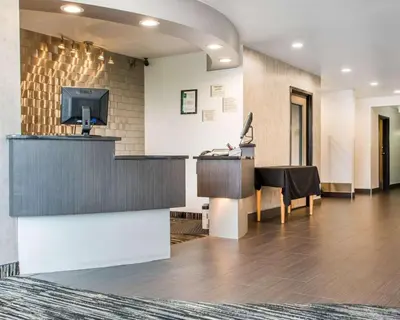 a lobby with a reception desk and a television at Quality Inn & Suites North-Polaris in Worthington