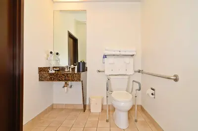 a bathroom with a toilet and a sink at Best Western Gas City in Gas City