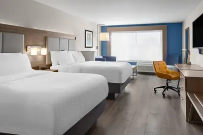 a hotel room with two beds and a desk at Holiday Inn Express & Suites Mt Sterling North by IHG in Mount Sterling
