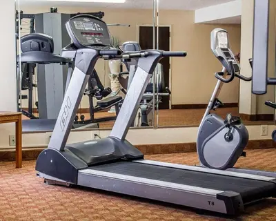 a gym with a treadmill in a room at Quality Inn Lima Northeast in Lima