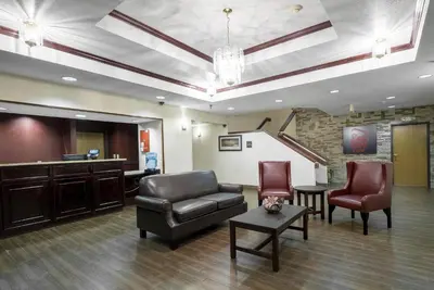 a waiting room with a couch and two chairs at Red Roof Inn Columbus - Hebron in Hebron