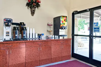 a kitchen with a counter with a coffee maker at Knights Inn Charleston West Virginia in Charleston