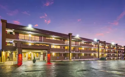 an empty parking lot in front of a building at Red Roof Inn Cincinnati Airport–Florence/ Erlanger in Erlanger