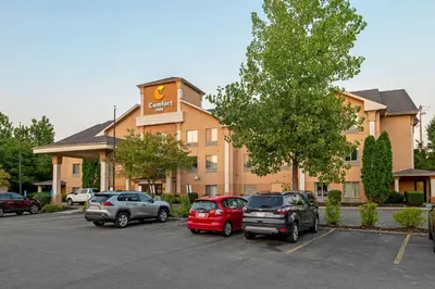 a hotel with cars parked in a parking lot at Comfort Inn Pickerington - Columbus East in Pickerington