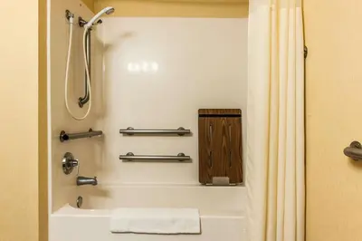 a bathroom with a shower and a bath tub at Comfort Inn Pickerington - Columbus East in Pickerington