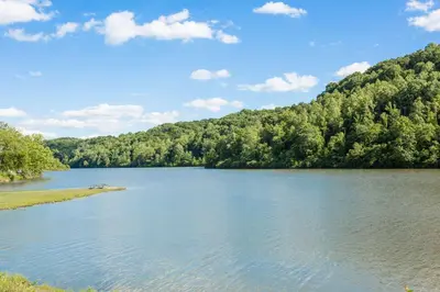 a view of a lake with trees in the background at Days Inn by Wyndham Athens in Athens