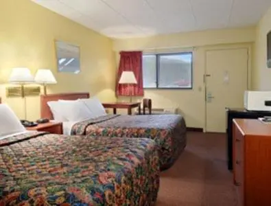 a hotel room with two beds and a window at Days Inn by Wyndham Athens in Athens
