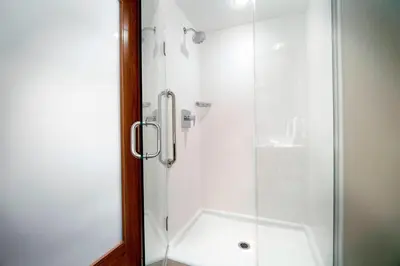 a bathroom with a shower with a glass door at SpringHill Suites by Marriott Columbus OSU in Columbus