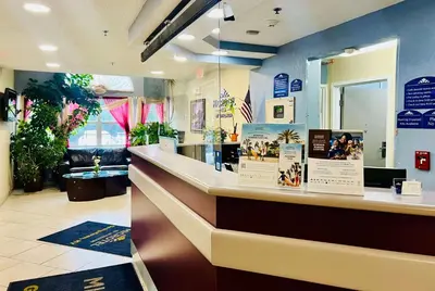 a restaurant with a counter in a store at Microtel Inn Georgetown - Lexington North in Georgetown