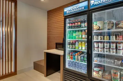 a refrigerator filled with lots of drinks at Holiday Inn Express & Suites Findlay North by IHG in Findlay