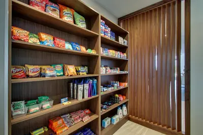 a book shelf filled with lots of food at Holiday Inn Express & Suites Findlay North by IHG in Findlay