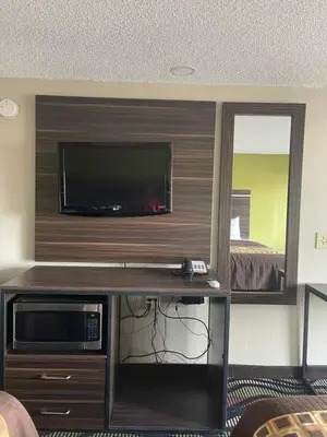 a room with a flat screen tv on a wall at Blue Stone Inn in Washington Court House