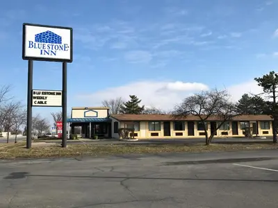 a building with a sign for a business inn at Blue Stone Inn in Washington Court House