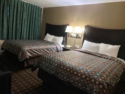a hotel room with two beds in a room at Executive Inn Chillicothe in Chillicothe