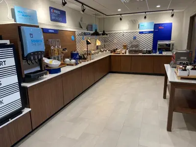 a store with a counter with a food at Holiday Inn Express & Suites Elyria by IHG in Elyria