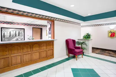 a waiting room at a hospital with a red chair at Super 8 by Wyndham Athens in Athens