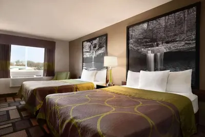 a hotel room with two beds and a window at Super 8 by Wyndham Akron S/Green/Uniontown OH in Uniontown